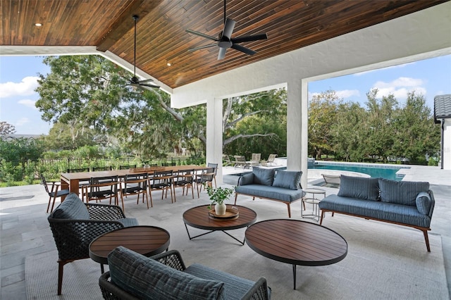 view of patio / terrace with an outdoor living space and ceiling fan