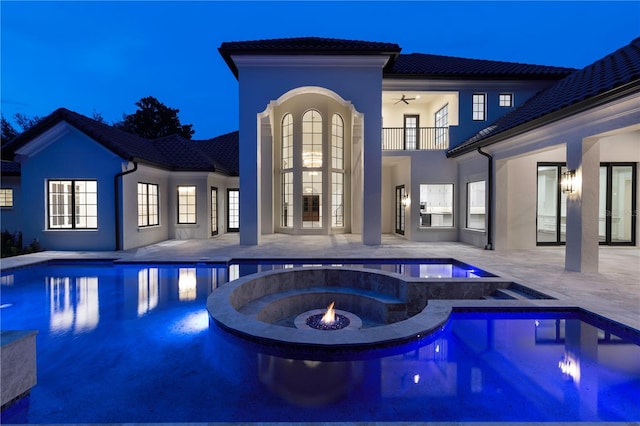 view of pool featuring an in ground hot tub, a patio, and ceiling fan