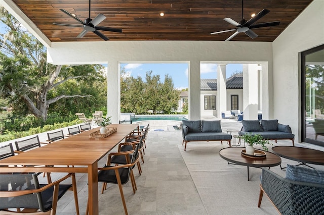 exterior space with ceiling fan and an outdoor hangout area