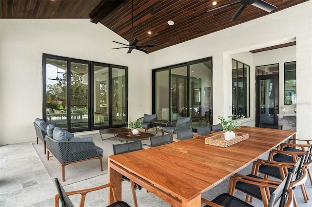 view of patio featuring exterior bar, an outdoor hangout area, and ceiling fan