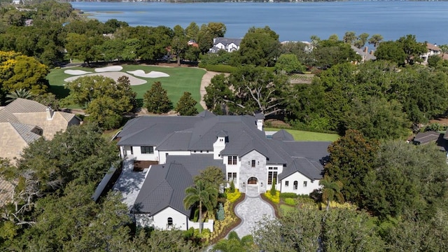 birds eye view of property with a water view