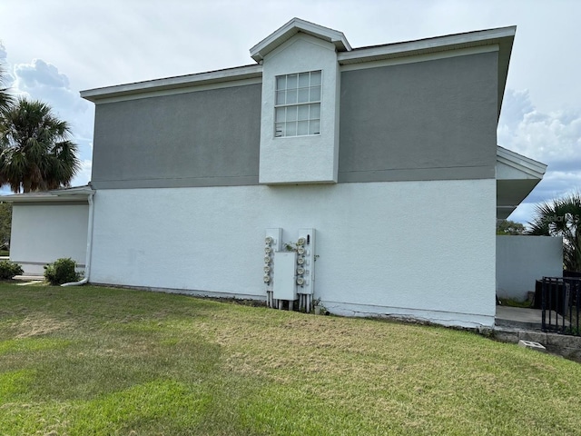 view of home's exterior featuring a lawn