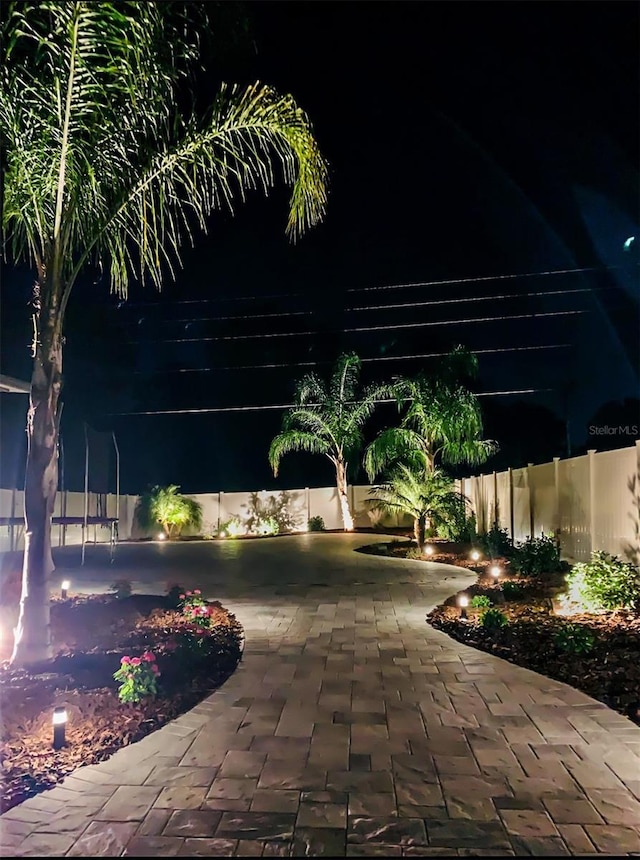 view of home's community with a patio area