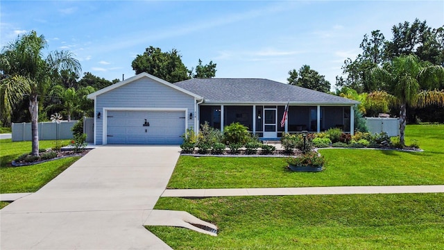 single story home featuring a garage, a front yard, and a sunroom