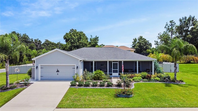 ranch-style house featuring a garage, a sunroom, and a front lawn