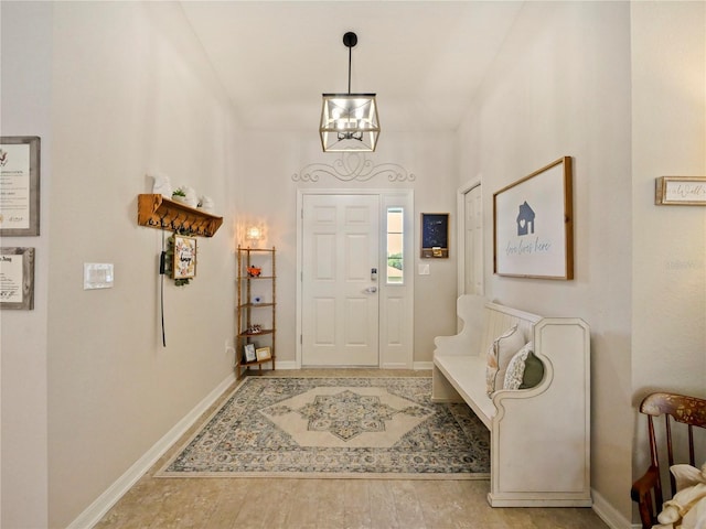 entrance foyer featuring hardwood / wood-style flooring and a notable chandelier