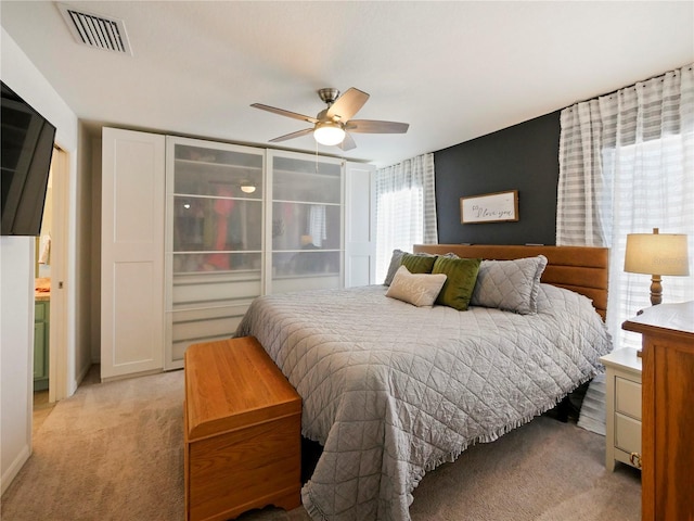 carpeted bedroom with ceiling fan