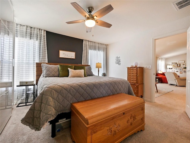 carpeted bedroom with ceiling fan