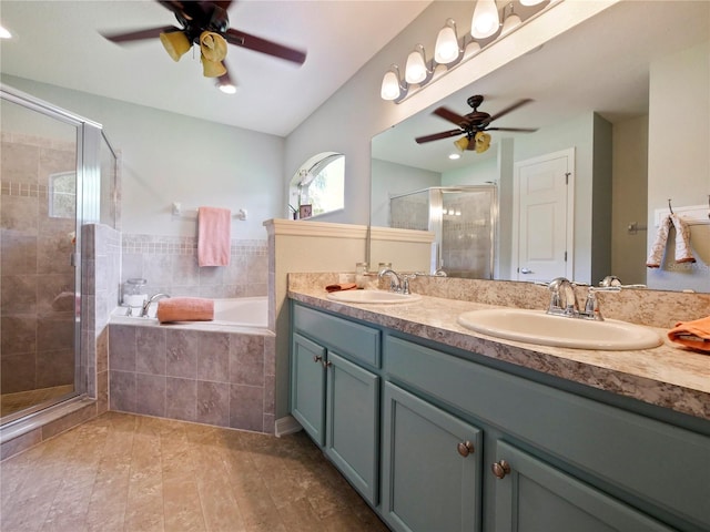 bathroom with ceiling fan, vanity, and shower with separate bathtub