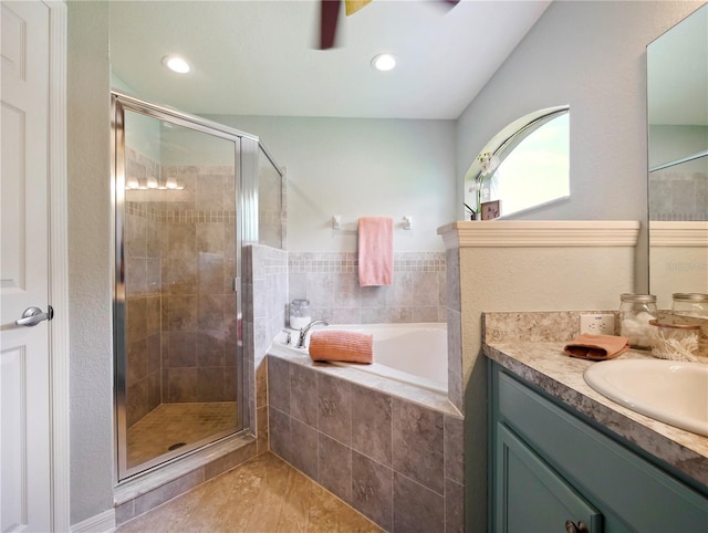 bathroom featuring tile patterned floors, vanity, and separate shower and tub