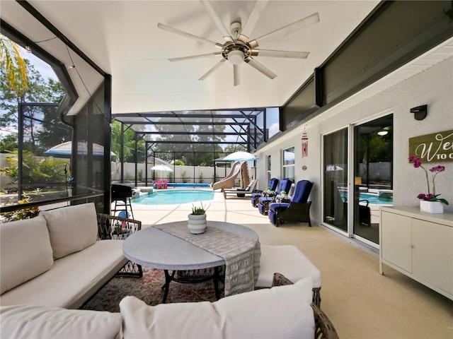 view of patio featuring an outdoor living space, a lanai, and a fenced in pool