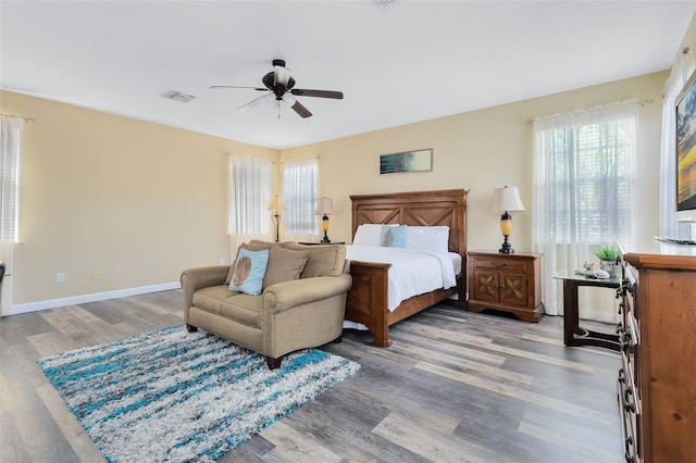 bedroom with hardwood / wood-style flooring and ceiling fan