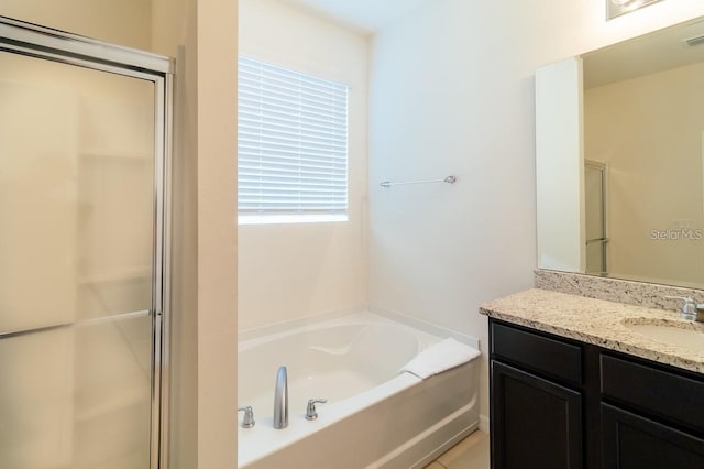 bathroom with plus walk in shower and vanity