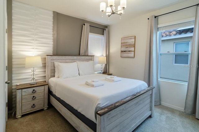 carpeted bedroom featuring multiple windows and a notable chandelier