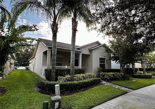 ranch-style house featuring a front yard