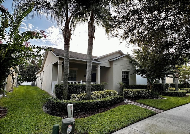 ranch-style house with a front lawn