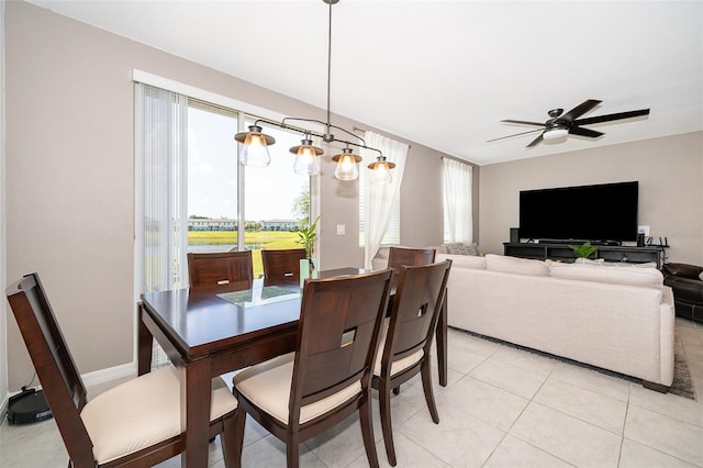 dining area with ceiling fan and light tile patterned floors