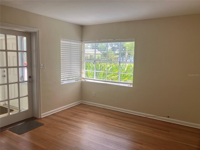 spare room featuring hardwood / wood-style flooring