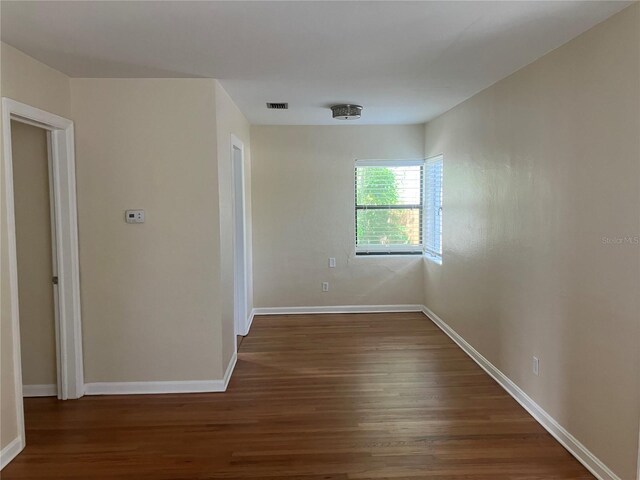 spare room with hardwood / wood-style flooring