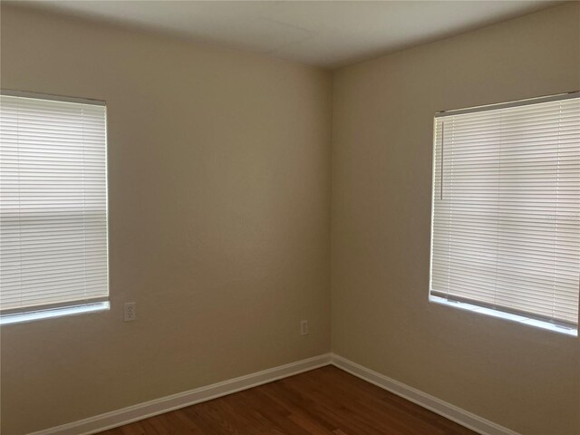 empty room featuring wood-type flooring