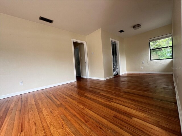 empty room featuring hardwood / wood-style floors