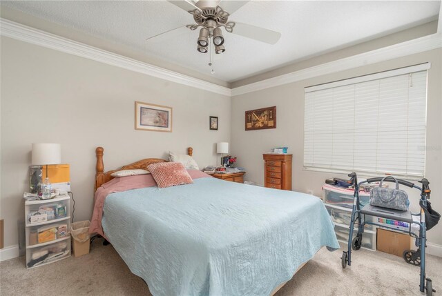 carpeted bedroom featuring crown molding, a textured ceiling, and ceiling fan