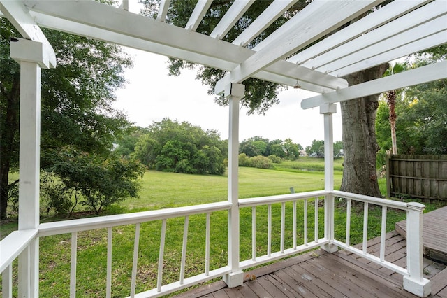 deck with a lawn, fence, and a pergola