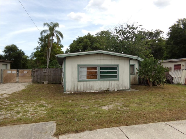 view of outbuilding featuring a yard