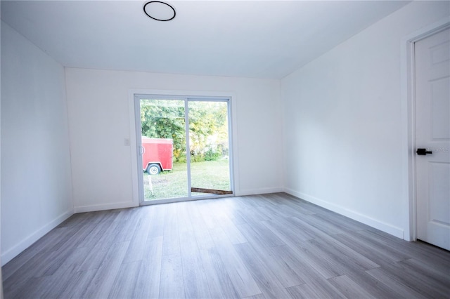 empty room featuring hardwood / wood-style flooring