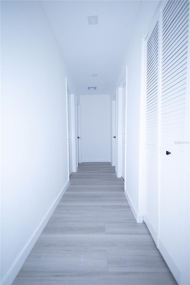 hallway featuring hardwood / wood-style floors