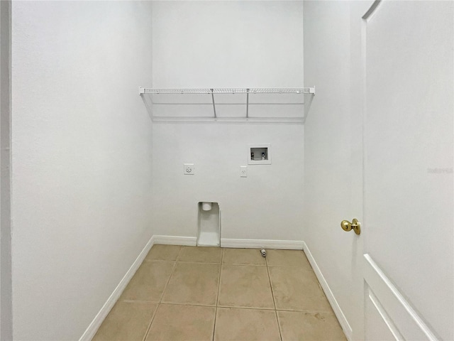 clothes washing area with light tile patterned floors, hookup for an electric dryer, and washer hookup