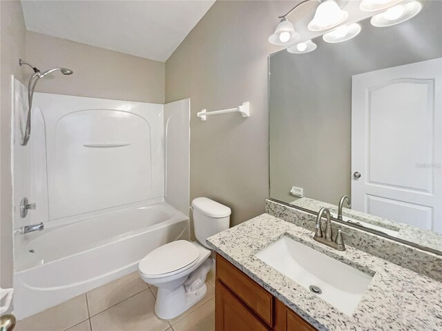 full bathroom featuring tub / shower combination, toilet, vanity, and tile patterned flooring