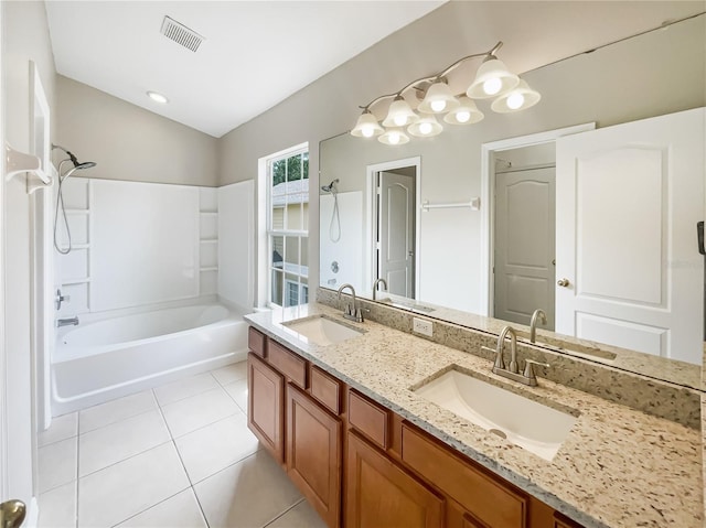 bathroom featuring tile patterned flooring, shower / washtub combination, lofted ceiling, and vanity