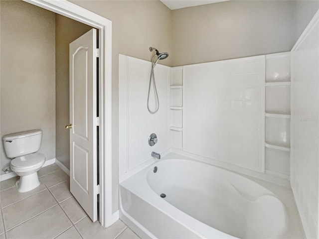 bathroom featuring tile patterned flooring, toilet, and shower / bath combination