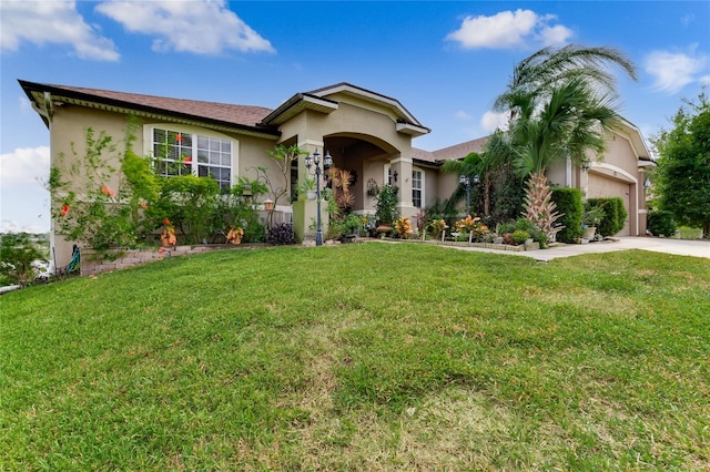 view of front of house featuring a garage and a front lawn