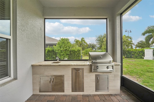 sunroom with sink and a healthy amount of sunlight