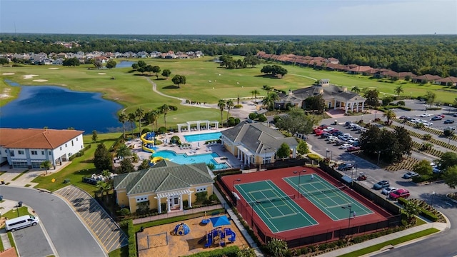 birds eye view of property with a water view