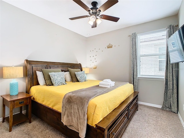 bedroom featuring light carpet and ceiling fan