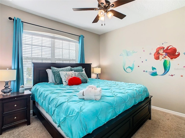 bedroom featuring light carpet and ceiling fan