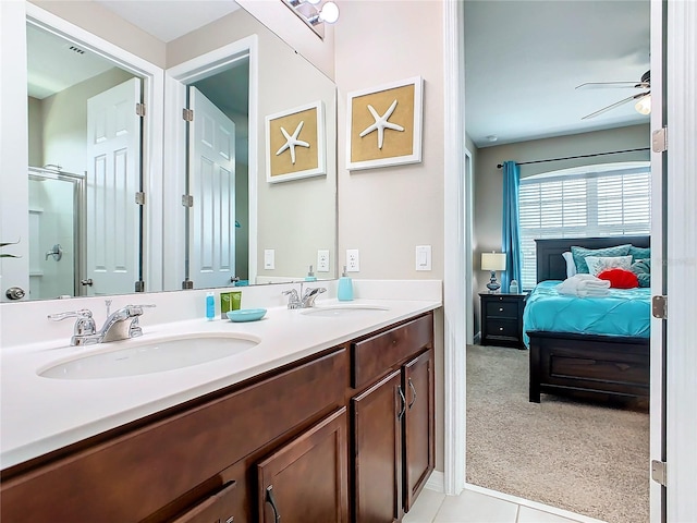 bathroom featuring dual vanity, ceiling fan, and tile patterned flooring