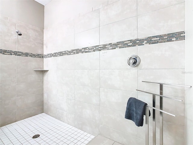 bathroom with a tile shower