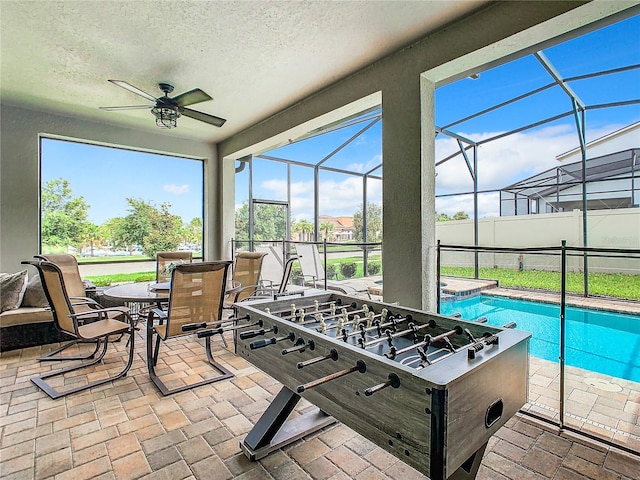 exterior space featuring ceiling fan