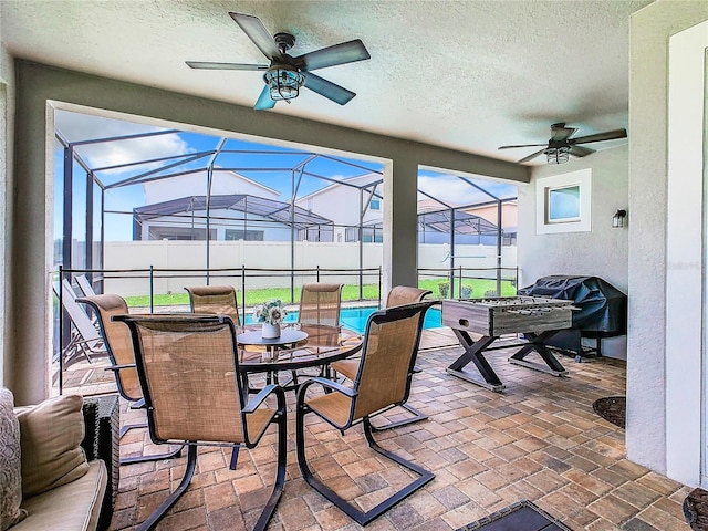 sunroom / solarium with ceiling fan