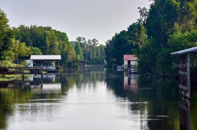 property view of water featuring a dock