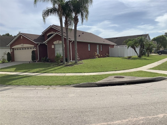 view of front of house with a garage and a front yard