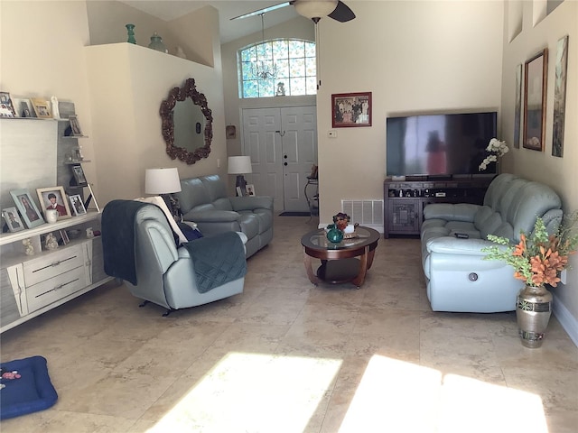 living room featuring high vaulted ceiling