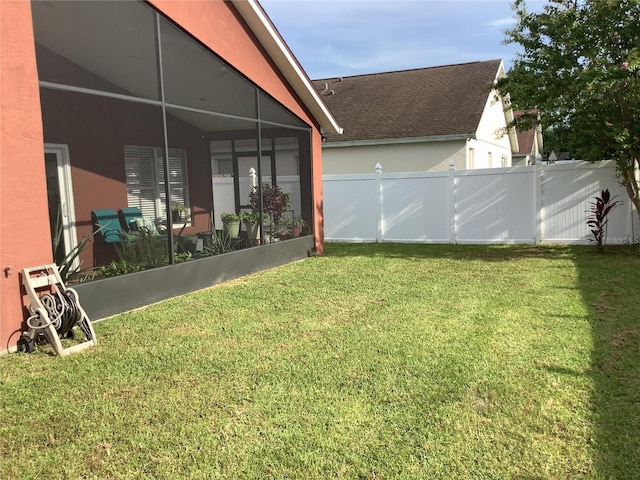 view of yard featuring glass enclosure