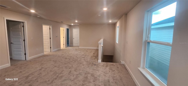 spare room featuring recessed lighting, visible vents, baseboards, and light colored carpet