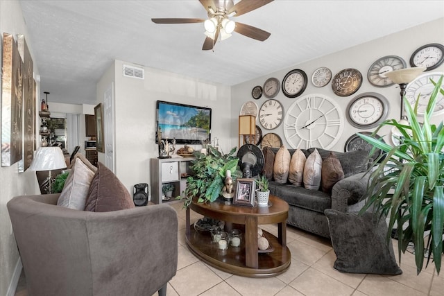 tiled living room featuring ceiling fan