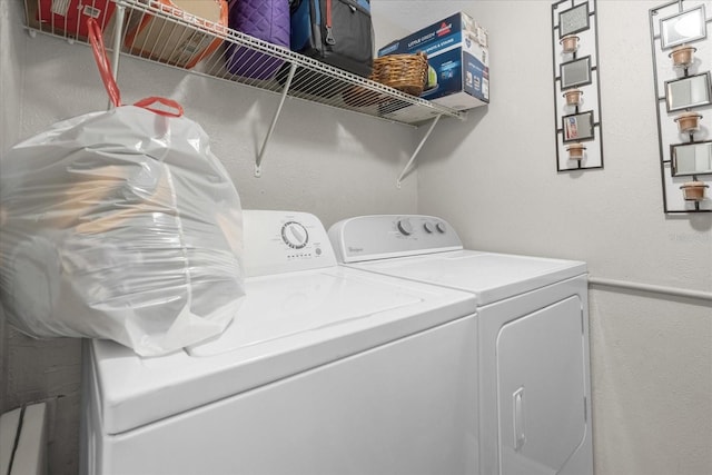 washroom with independent washer and dryer